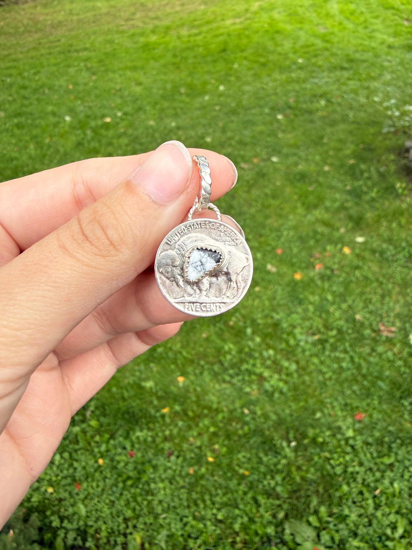 Buffalo coin pendant with white buffalo